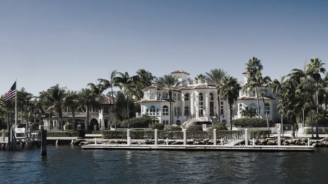 Waterfront homes under palm trees in Florida