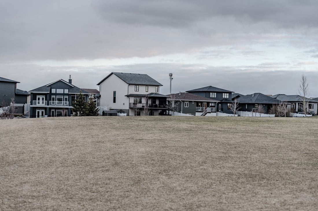 Suburban homes overlooking open fields