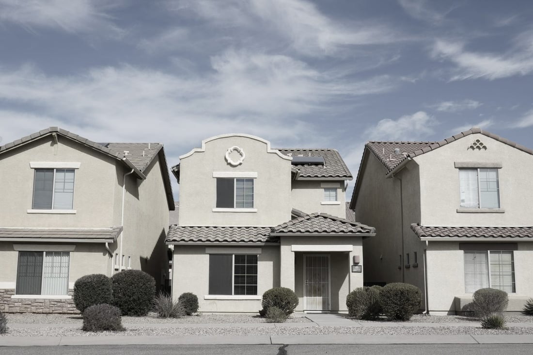 Single-story homes in a desert suburban neighborhood in Arizona