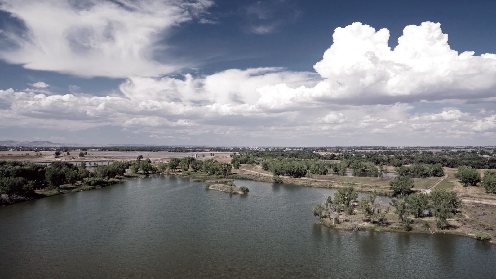 Scenic Northern Colorado landscape with lake and front range foothills