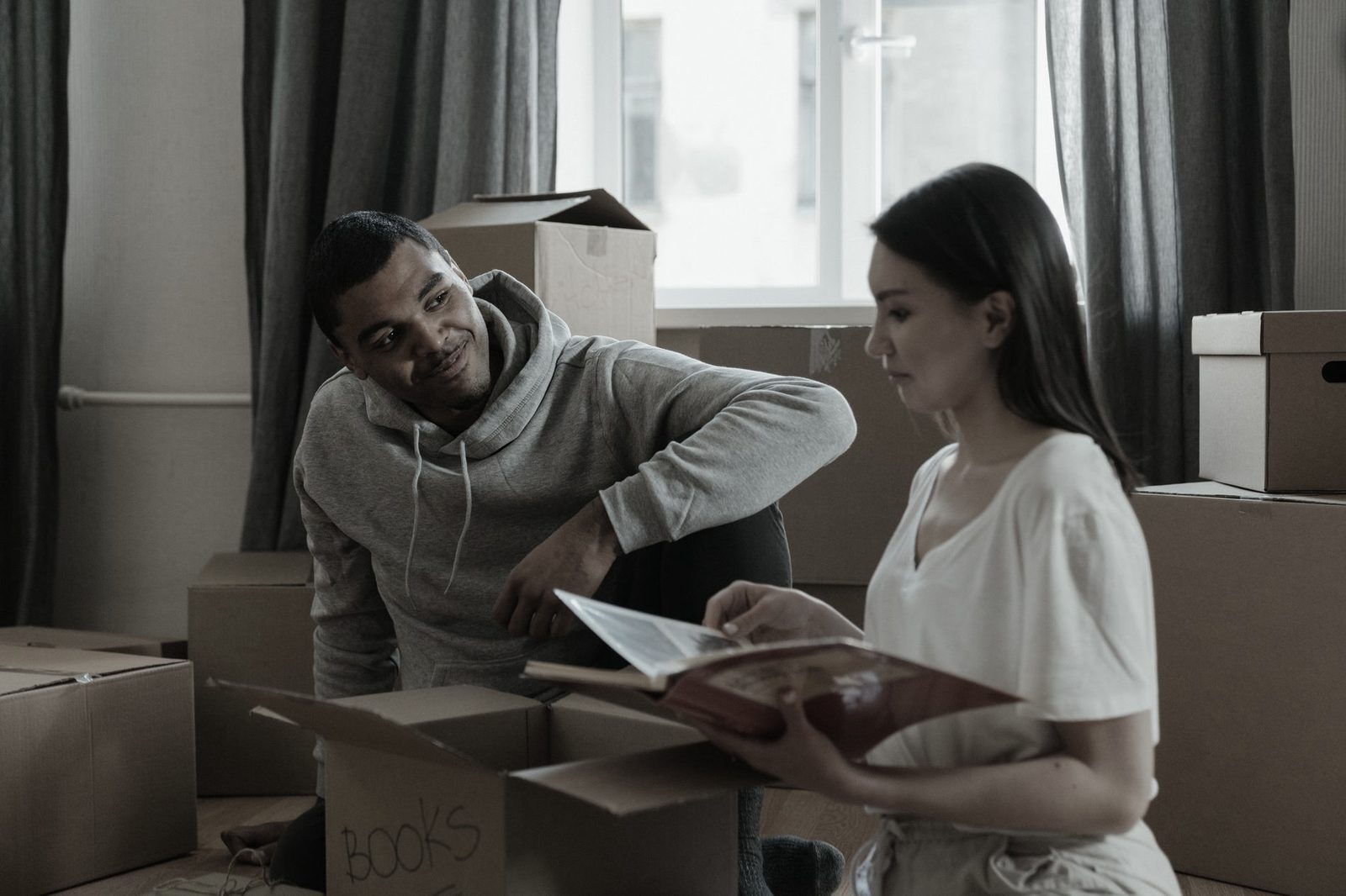Couple unpacking boxes in their new home