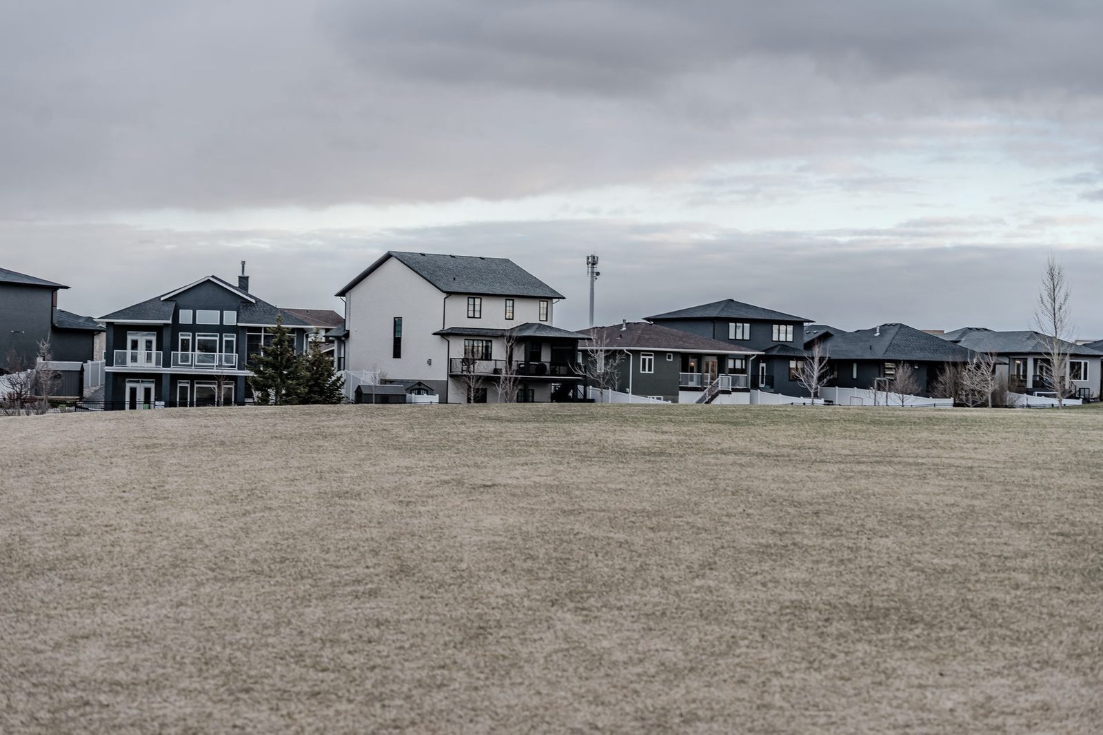 Suburban homes overlooking open fields